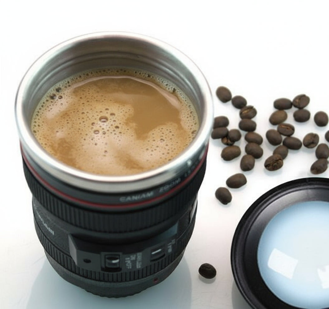 Camera lens mug with coffee and beans on a white background, featuring the brand 'Transhome'.